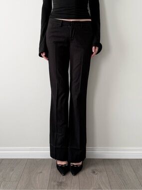 Talulah black pinstripe low rise flared trousers.